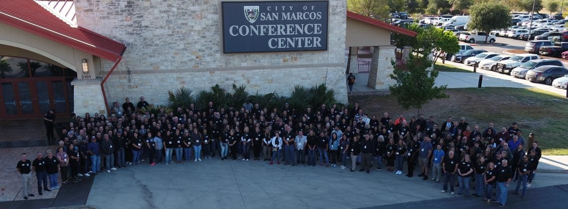 Large group outside San Marcos Conference Center.