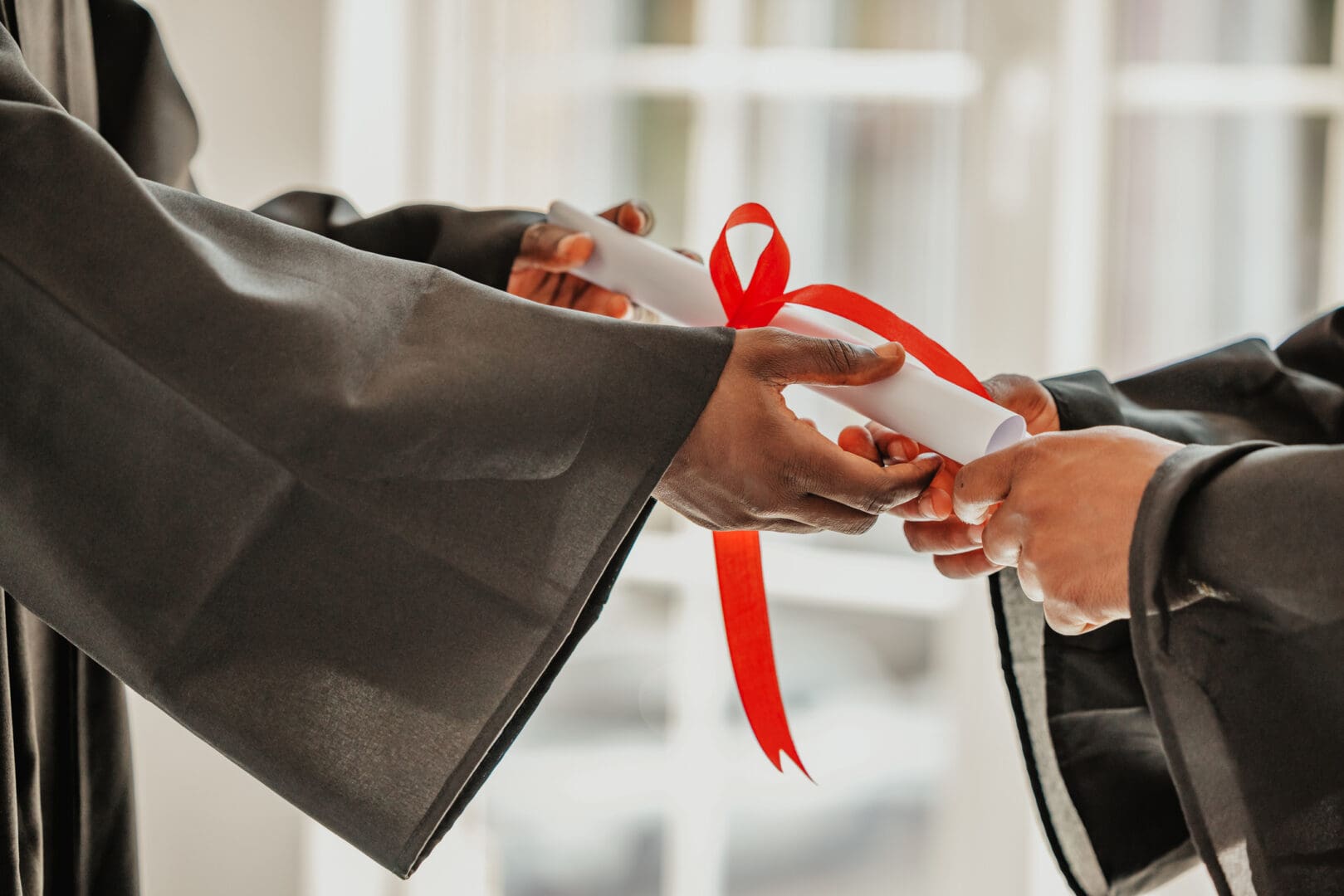Graduation ceremony with diploma exchange.