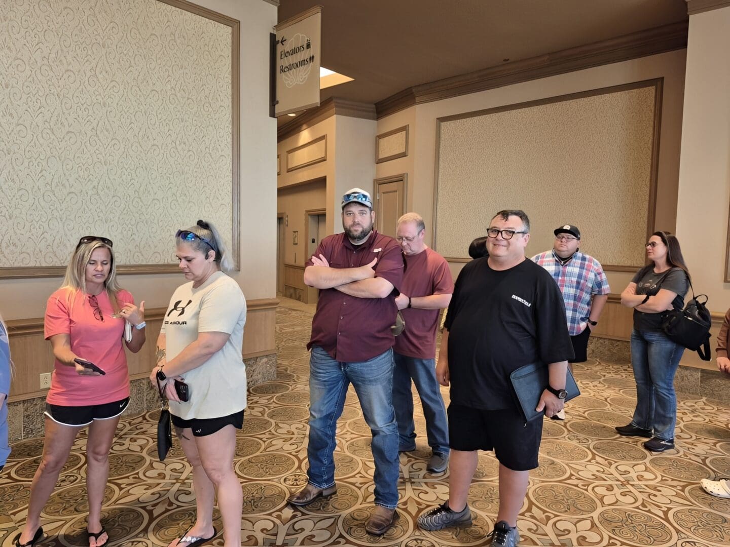 Group waiting in hallway