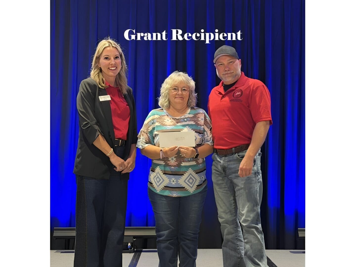 Grant recipient posing with award presenters