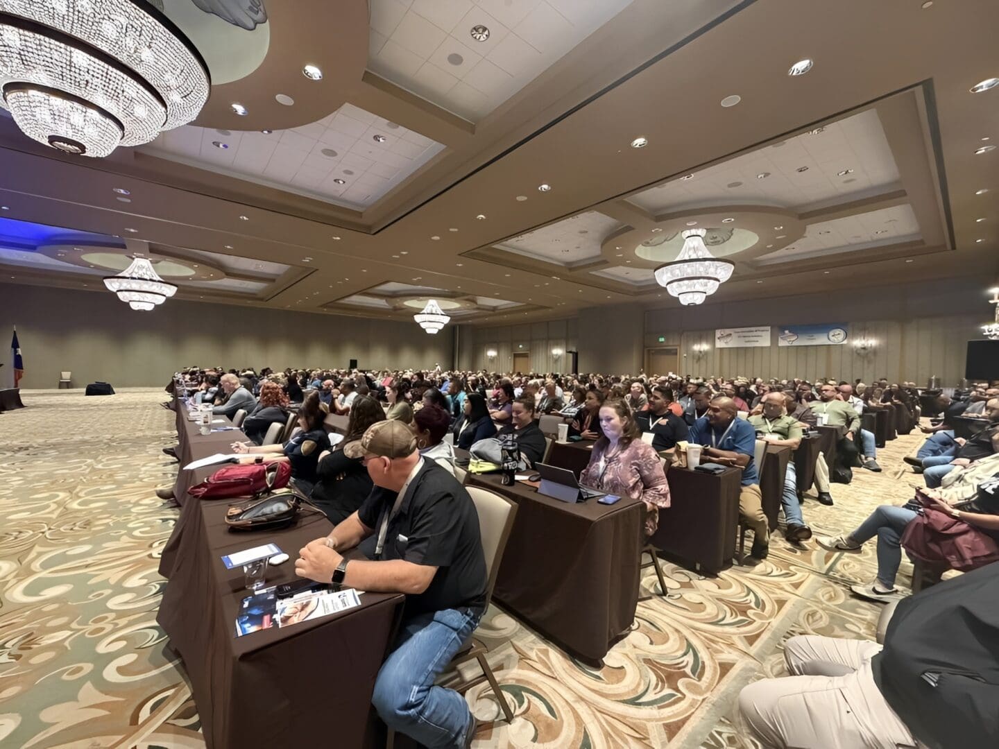 Audience listening attentively in conference hall