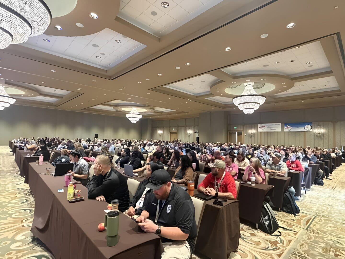 Attendees seated at a conference event