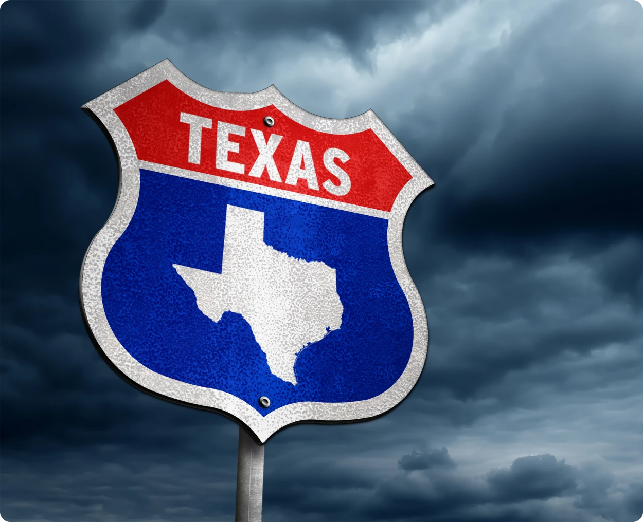Texas highway sign with stormy sky