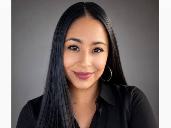 Smiling woman with long straight black hair