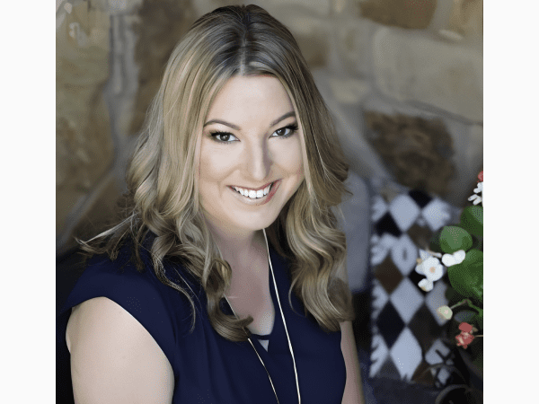 Smiling blonde woman in navy blouse