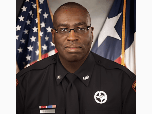 Uniformed police officer portrait with flags